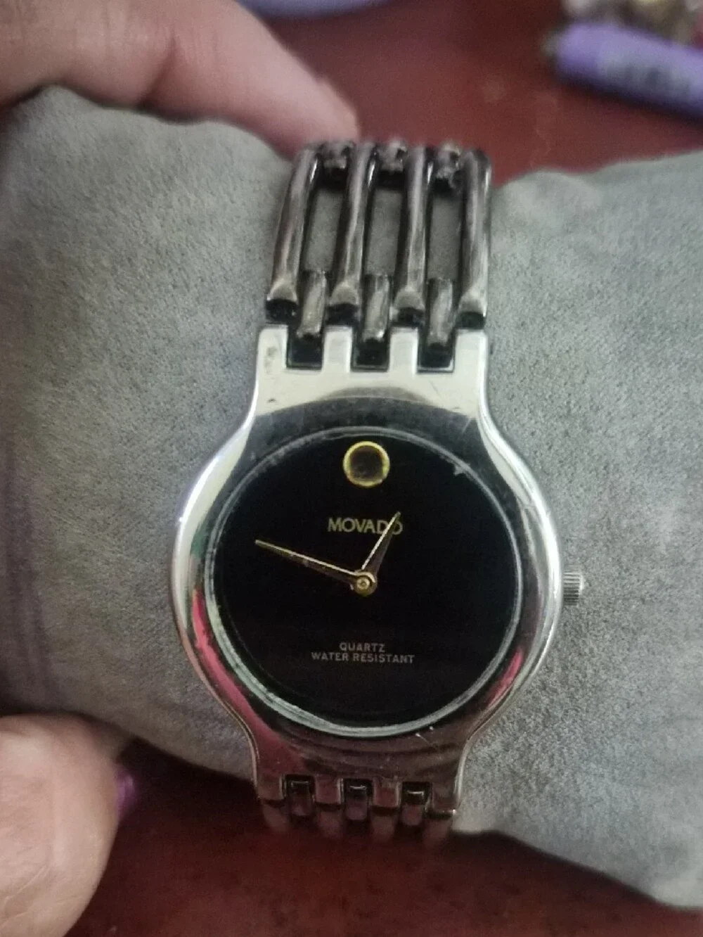 Movado Black Dial Silver Bracelet Watch with Gold Accents